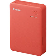Canon SELPHY Square QX20 portable photo printer in terracotta red, compact rectangular body with integrated paper slot.