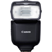 Canon Speedlite EL-10 on camera hot shoe — compact black flash unit with zooming flash head and built-in bounce diffuser card.