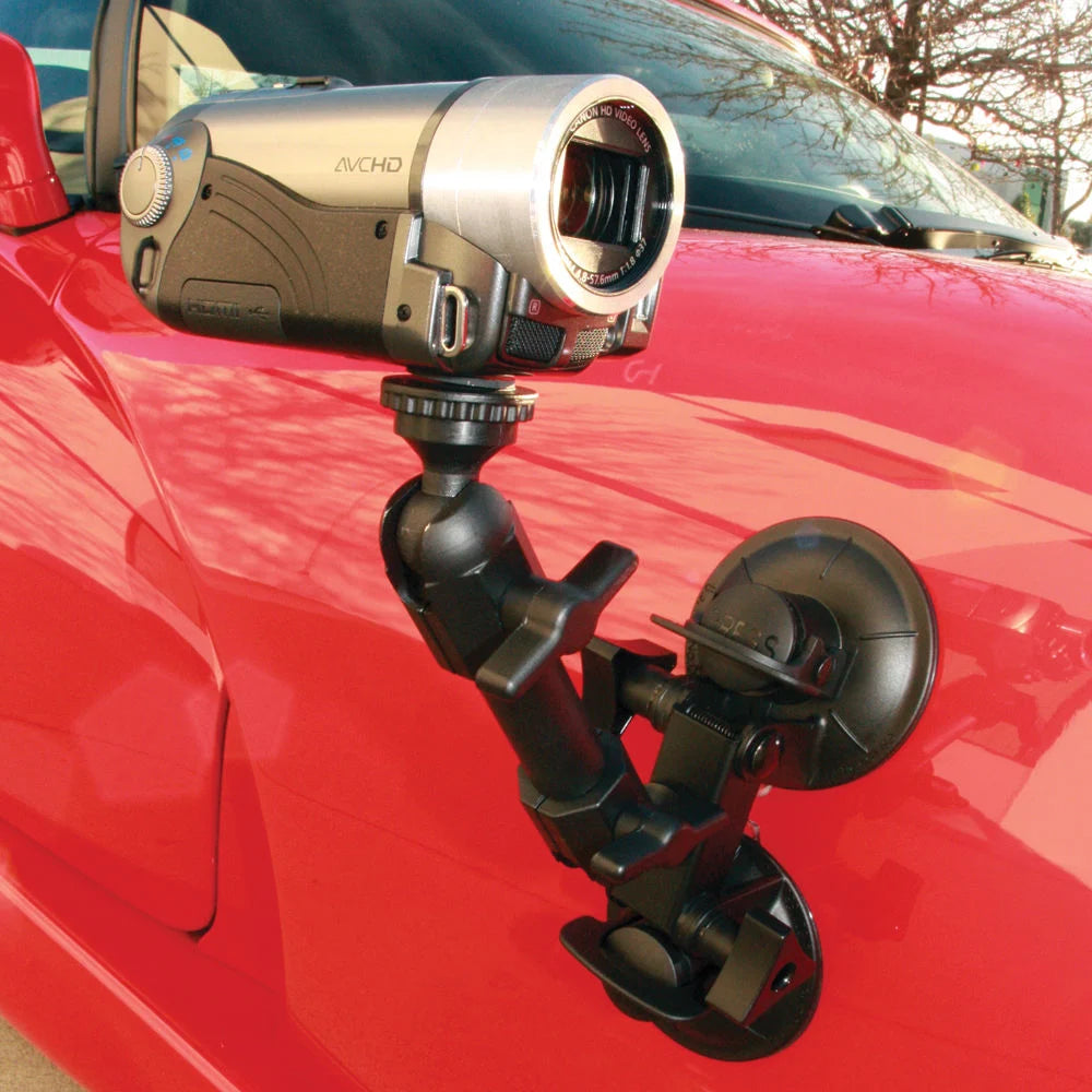 Delkin Devices Fat Gecko Dual-Suction Camera Mount, featuring two ~7 cm industrial-grade suction cups connected to a central adjustable arm with multiple locking joints, topped by a ¼-20 mounting screw and 360° ball-head for versatile camera positioning.