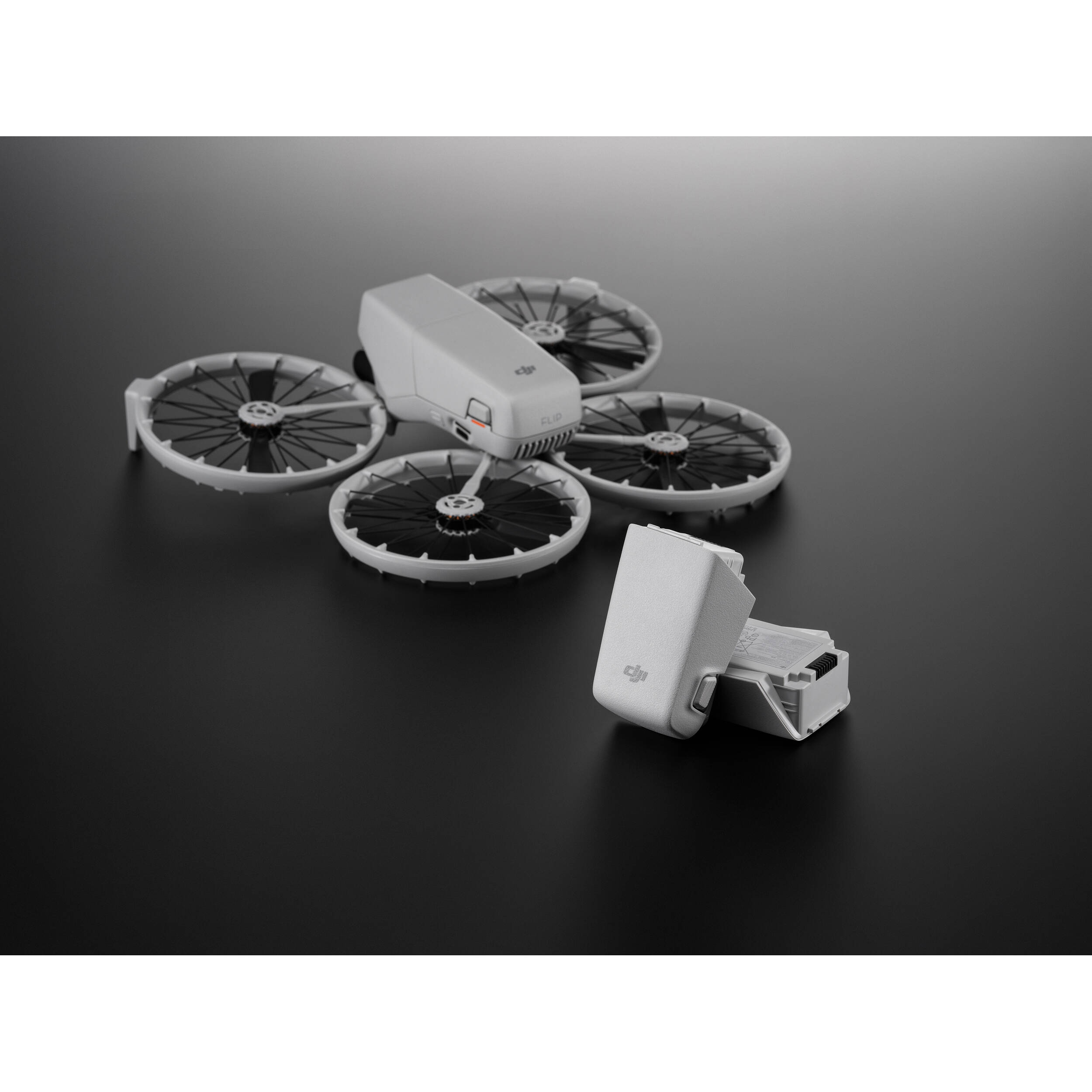 A black DJI Intelligent Flight Battery is shown, featuring a power button and four LED indicators.