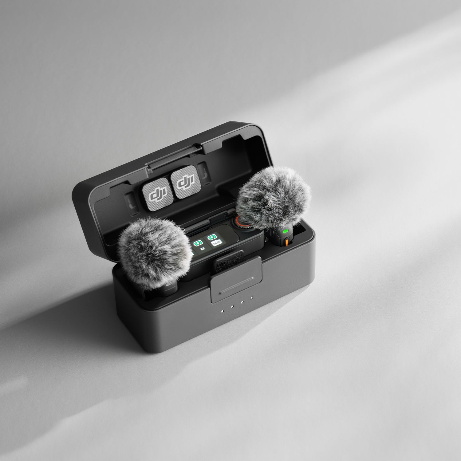 DJI Mic 3 wireless microphone system with transmitters, receiver, and charging case.