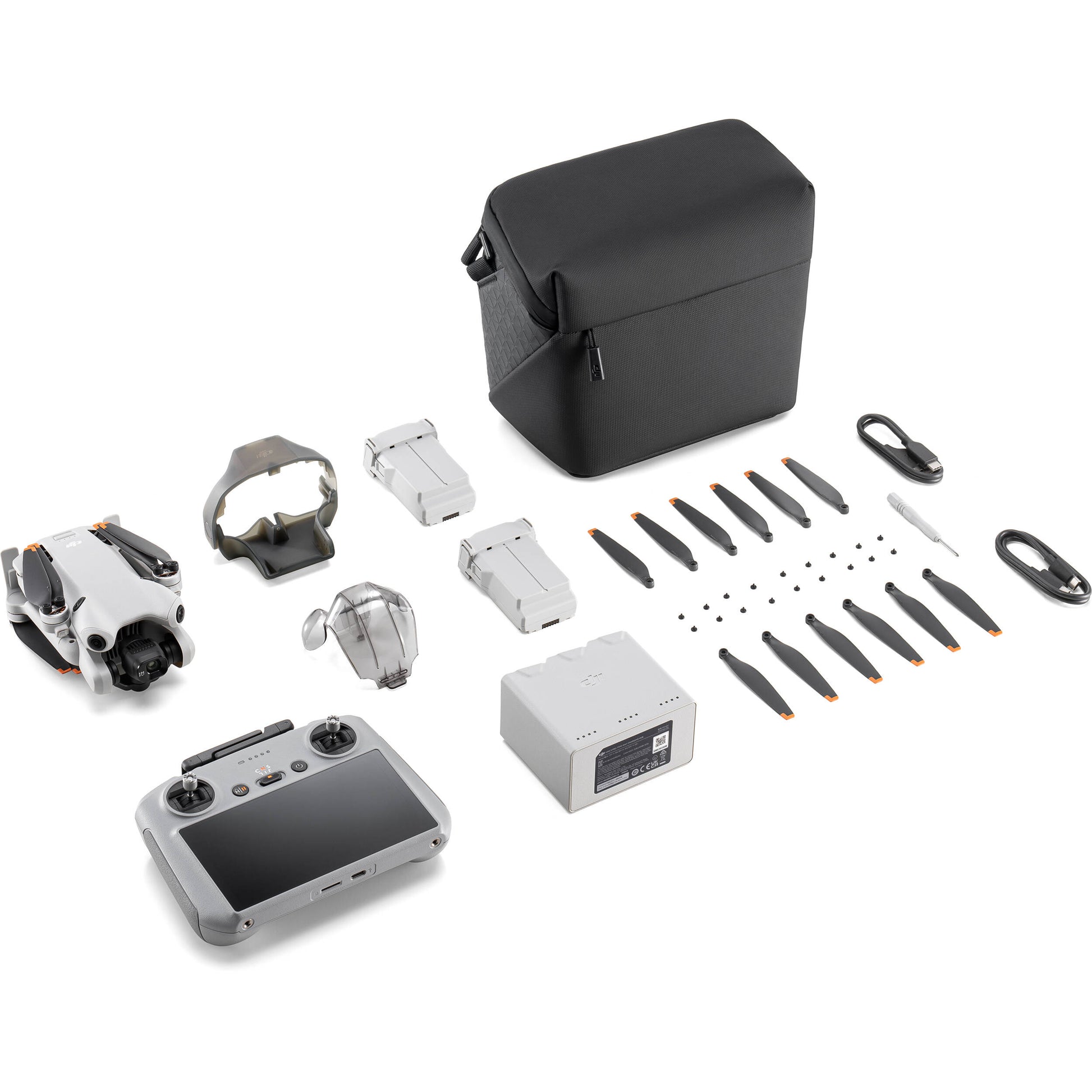 DJI Mini 4 Pro Fly More Combo drone with RC2 controller, featuring a lightweight design under 249g, 4K/60fps HDR video capability, omnidirectional obstacle sensing, and advanced tracking features