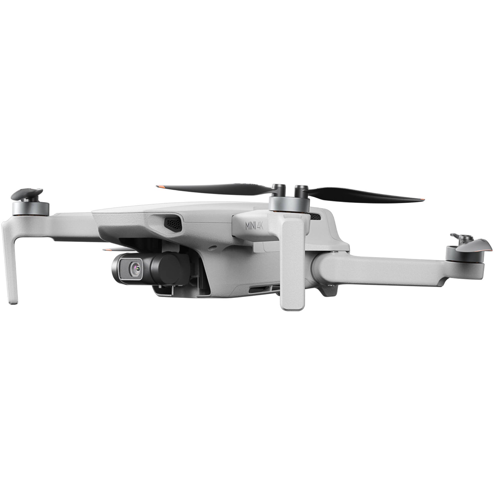 DJI Mini 4 K Fly More Combo — foldable camera drone with controller, three batteries, charging hub, shoulder bag, spare props, and accessories laid out.