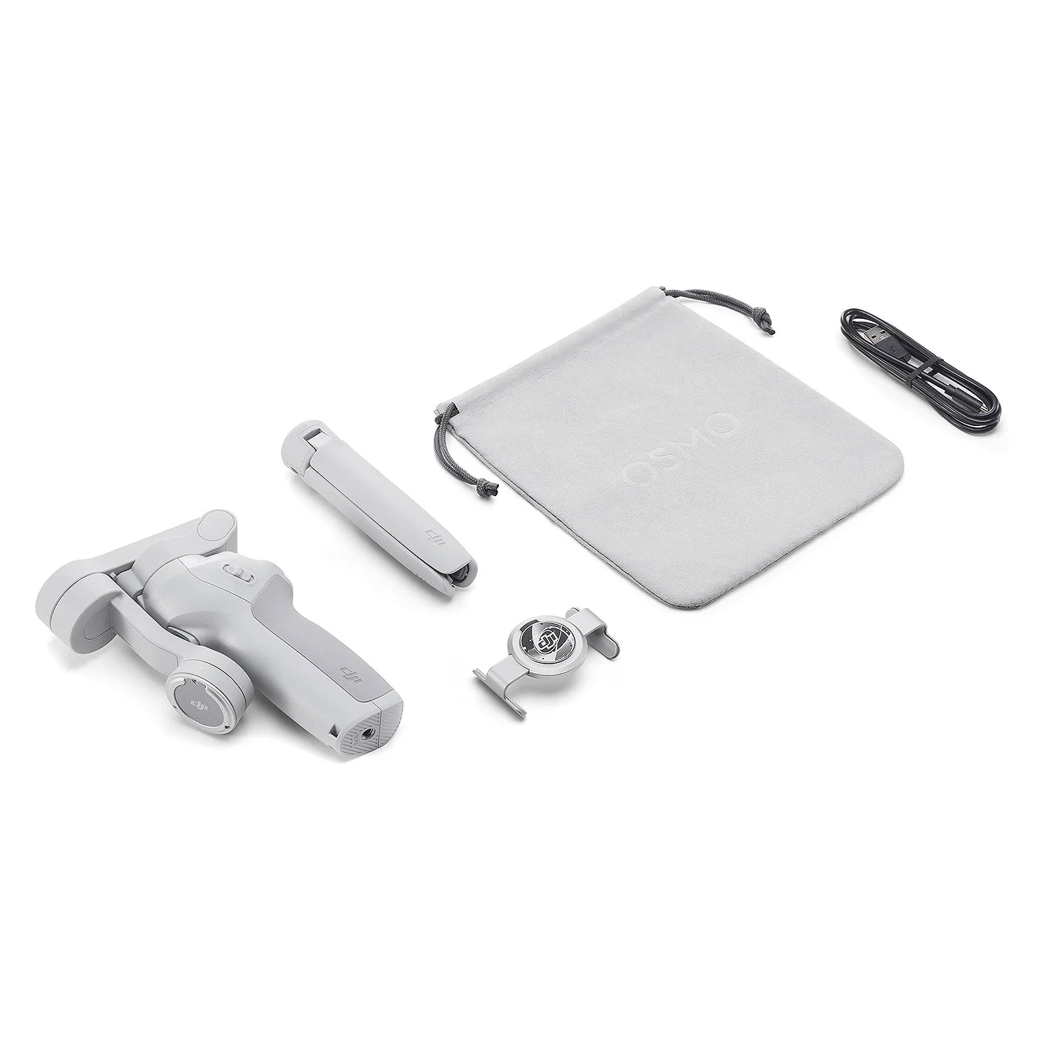 Set of electronic components including a white device, cable, and pouch on a white background