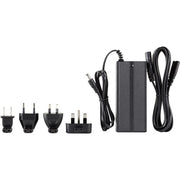 Black power adapter with multiple plug sockets on a white background