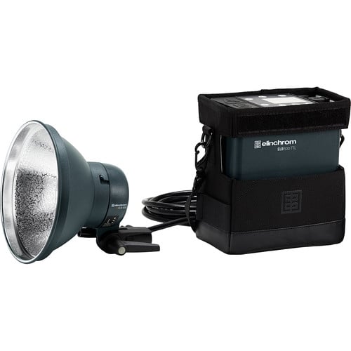 Studio light with reflector and power pack on a white background, featuring the Elinchrom brand.