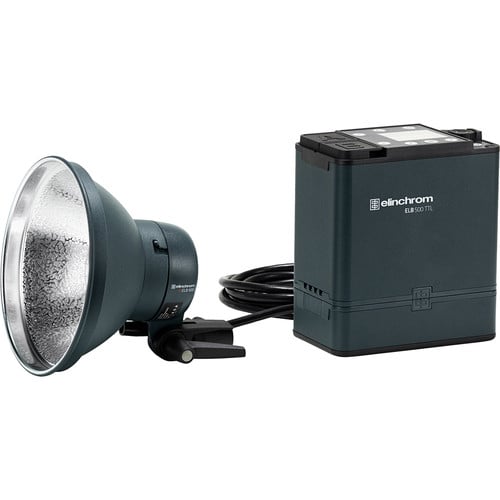 Studio light with reflector and power pack on a white background, featuring Elinchrom branding.