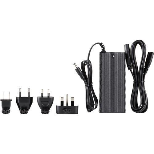 Power adapter with multiple plug types on a white background