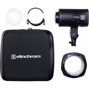 Elinchrom photography light kit with flash unit, softbox, and accessories on a white background