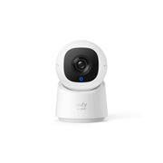White security camera with a black lens on a white background