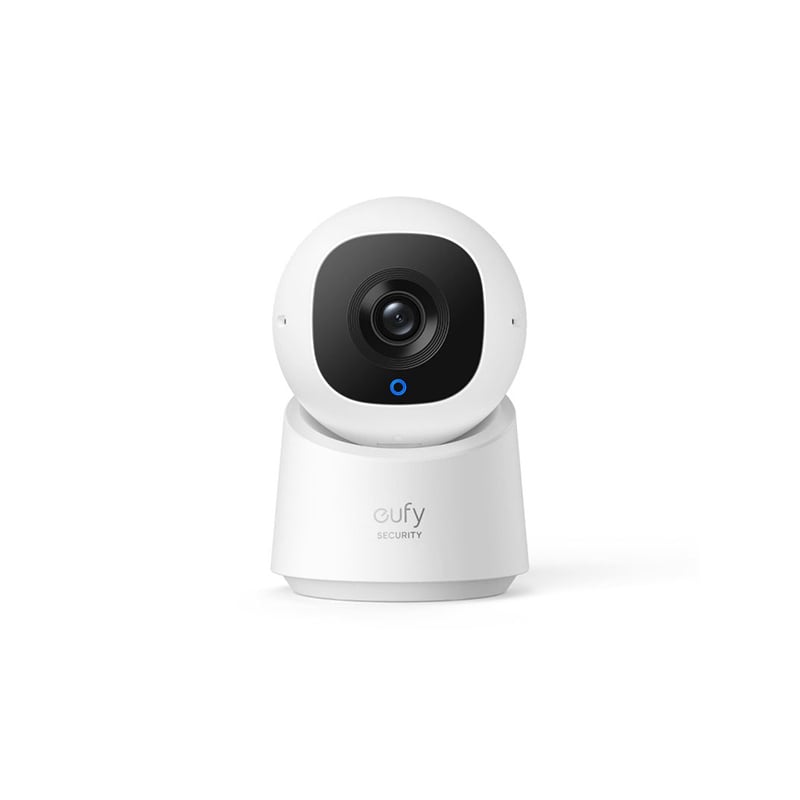 White security camera with a black lens on a white background