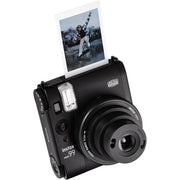 Fujifilm Instax Mini 99 instant film camera in vintage beige with textured grip, built-in flash, selfie mirror, and classic analog controls.
