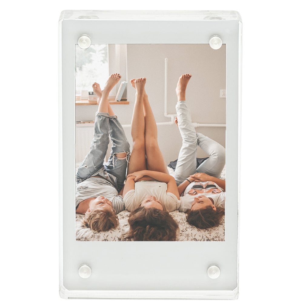 Fujifilm Instax Mini clear acrylic magnetic frame designed to hold and display Instax Mini photos securely with four magnets