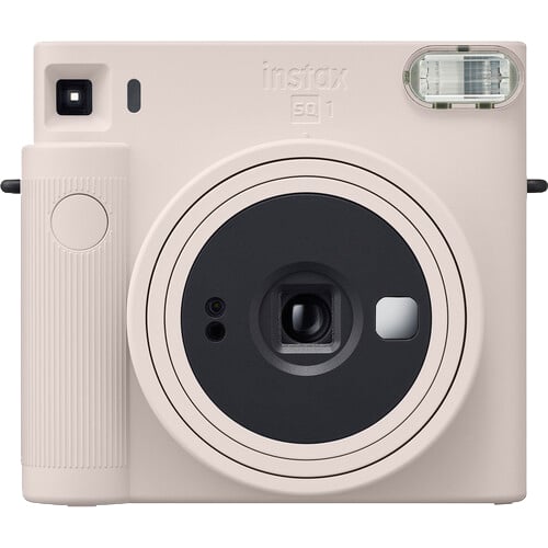 Pink instant camera with 'instax' branding on a white background