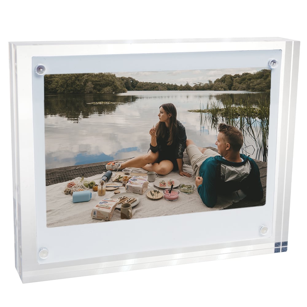 Fujifilm Instax Wide Acrylic Magnetic Frame – clear two-piece acrylic holder with four corner magnets, displaying a wide-format instant photograph and designed for easy sliding insertion on magnetic surfaces.