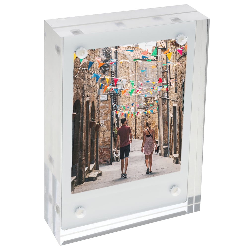 Fujifilm Instax Wide Acrylic Magnetic Frame – clear two-piece acrylic holder with four corner magnets, displaying a wide-format instant photograph and designed for easy sliding insertion on magnetic surfaces.