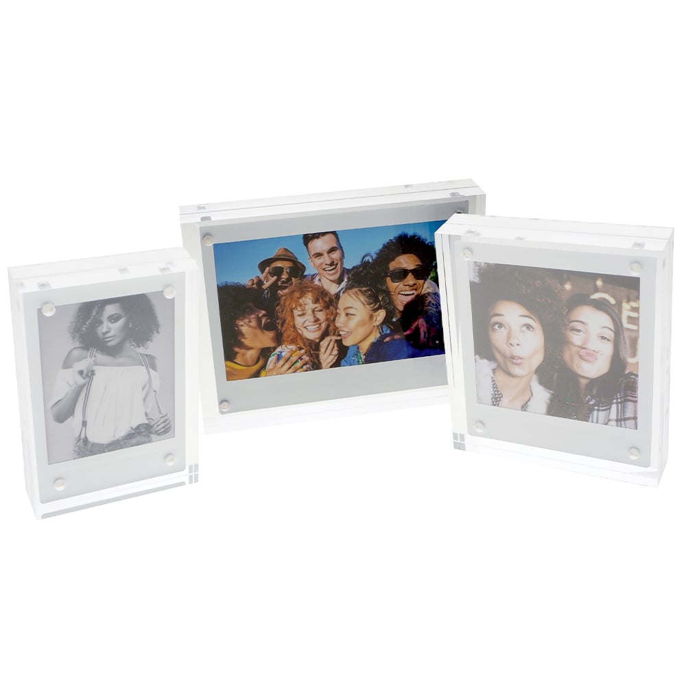 Fujifilm Instax Wide Acrylic Magnetic Frame – clear two-piece acrylic holder with four corner magnets, displaying a wide-format instant photograph and designed for easy sliding insertion on magnetic surfaces.