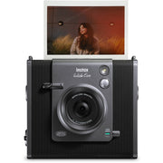 Fujifilm Instax Wide Evo hybrid instant camera with 16MP 1/3-inch CMOS sensor, fixed 16mm f/2.4 wide-angle lens, 10 lens and film effects, selfie mirror, built-in flash, tripod mount, and USB-C charging.
