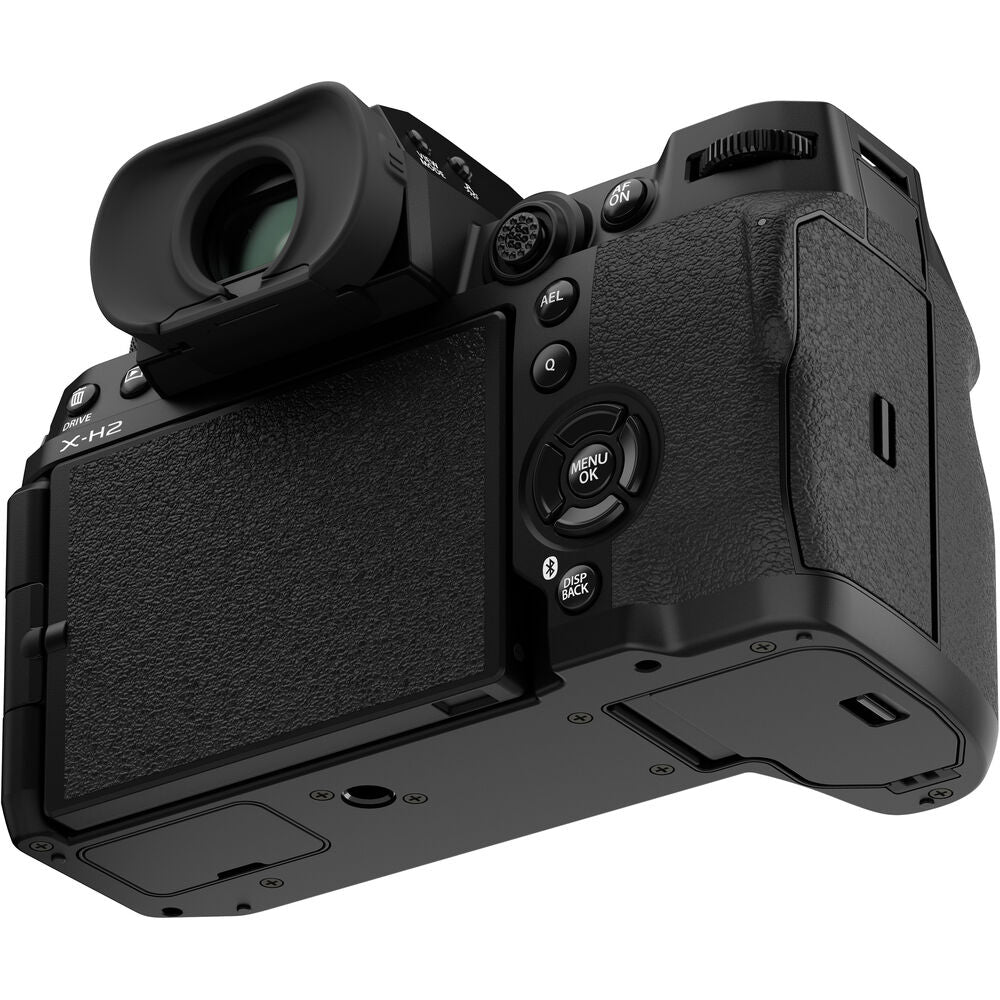 Fujifilm X‑H2 mirrorless camera body in black, featuring a robust APS‑C mount design with grip, vari-angle touchscreen, top-panel status LCD, and electronic viewfinder.