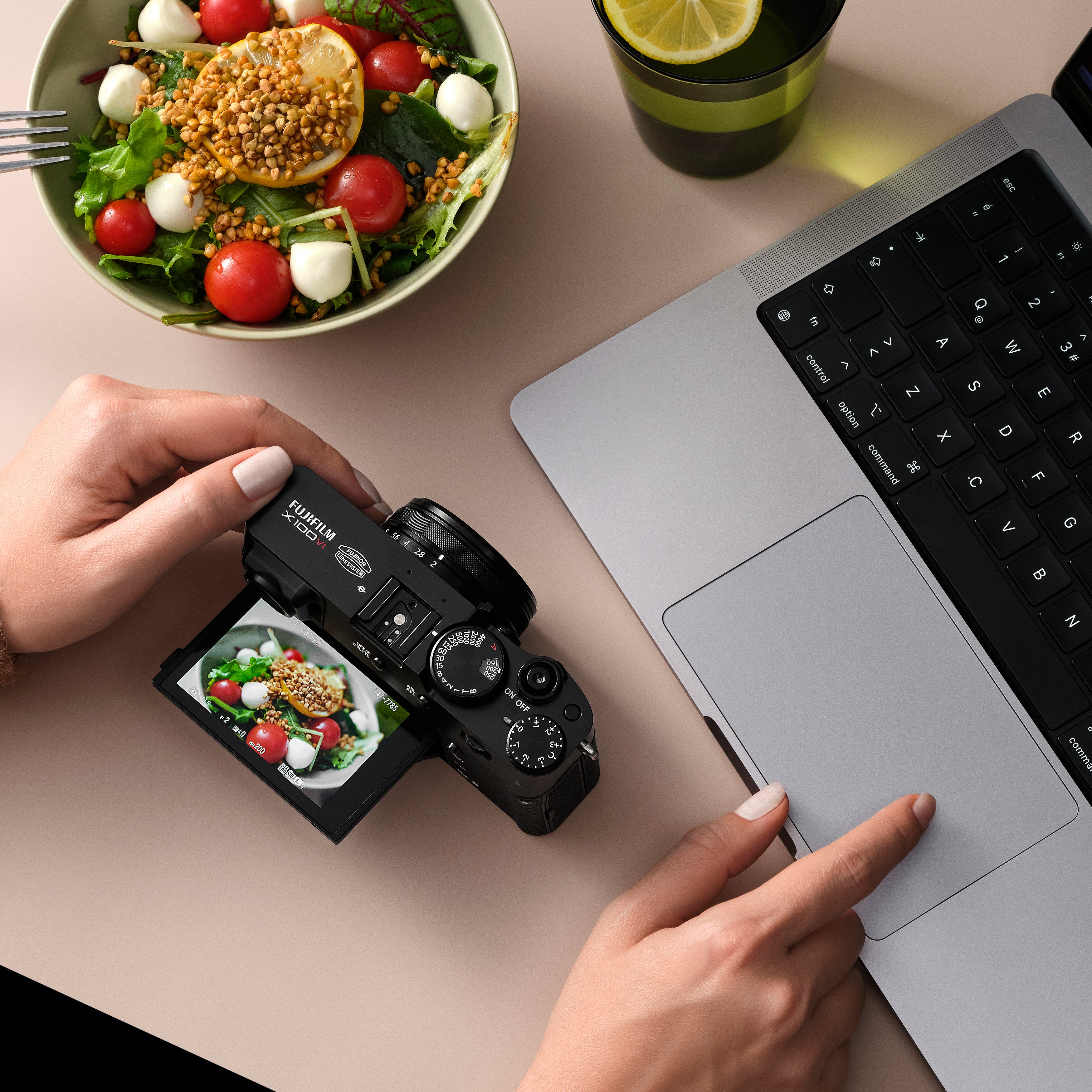 Fujifilm X100VI black compact digital camera featuring 40.2MP APS-C X-Trans CMOS 5 HR sensor, 23mm f/2 fixed lens, 5-axis in-body image stabilization, hybrid optical/electronic viewfinder, and 3-inch tilting touchscreen.