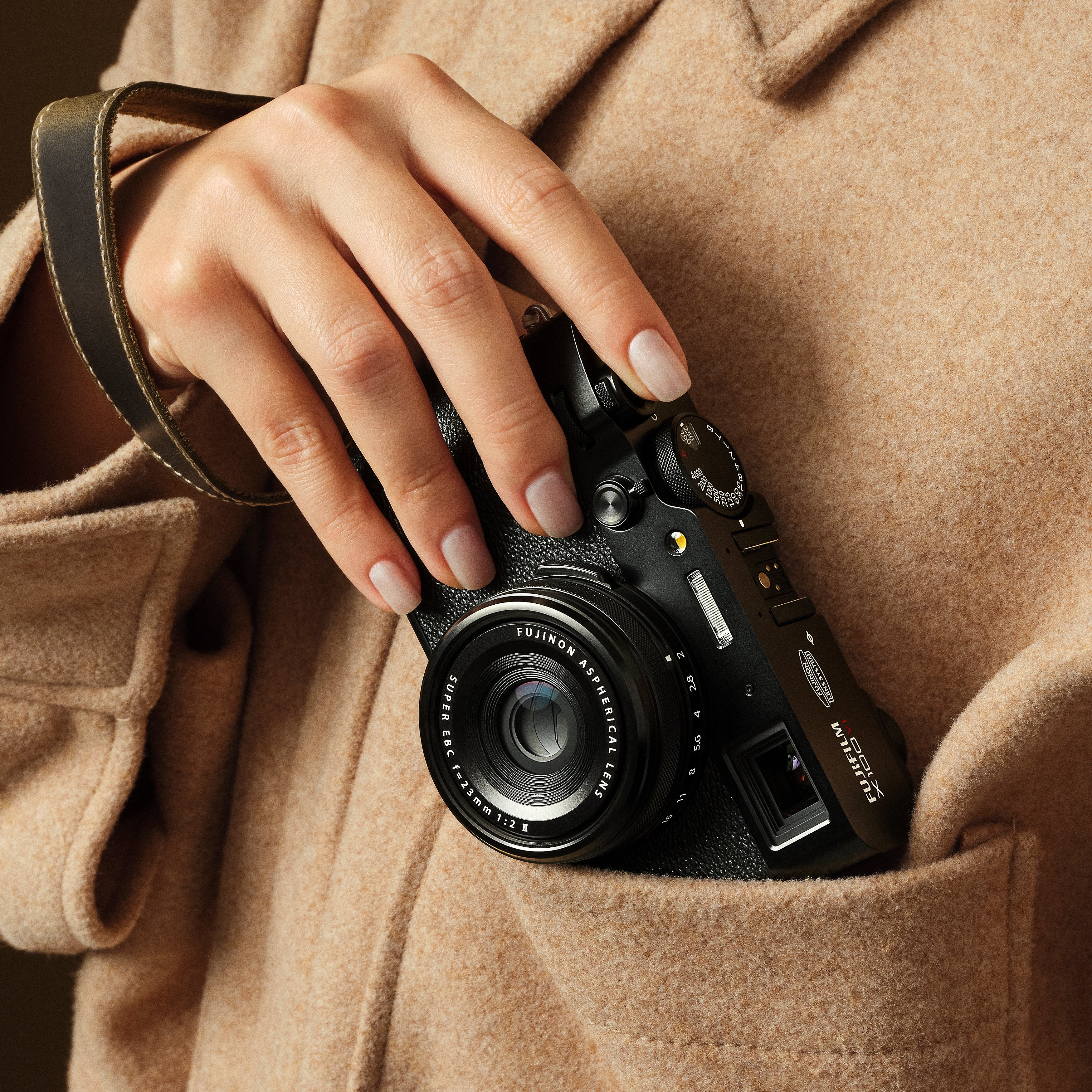 Fujifilm X100VI black compact digital camera featuring 40.2MP APS-C X-Trans CMOS 5 HR sensor, 23mm f/2 fixed lens, 5-axis in-body image stabilization, hybrid optical/electronic viewfinder, and 3-inch tilting touchscreen.