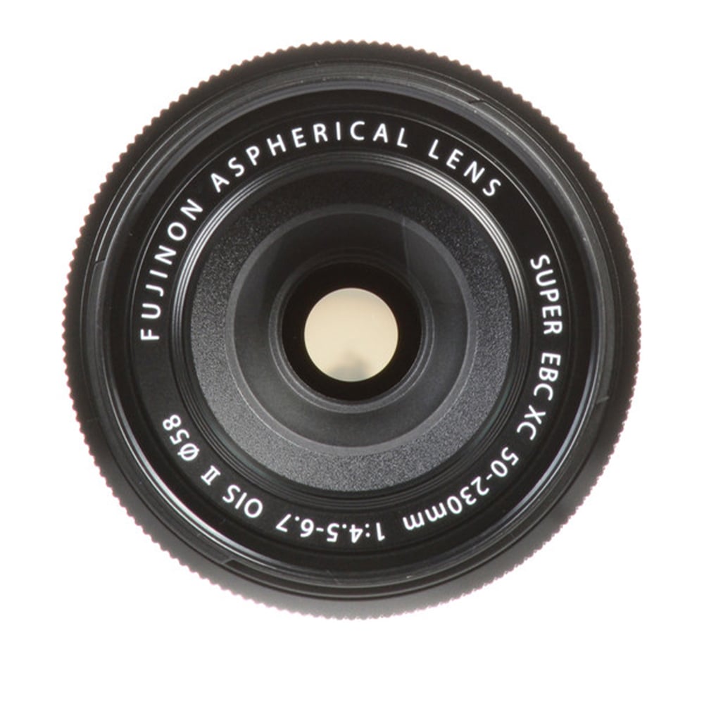 Camera lens with Fujifilm branding on a white background