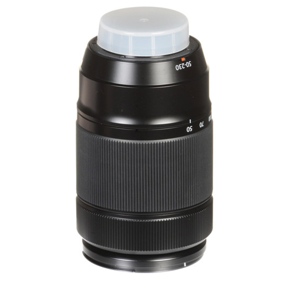 Camera lens with a white cap on a white background