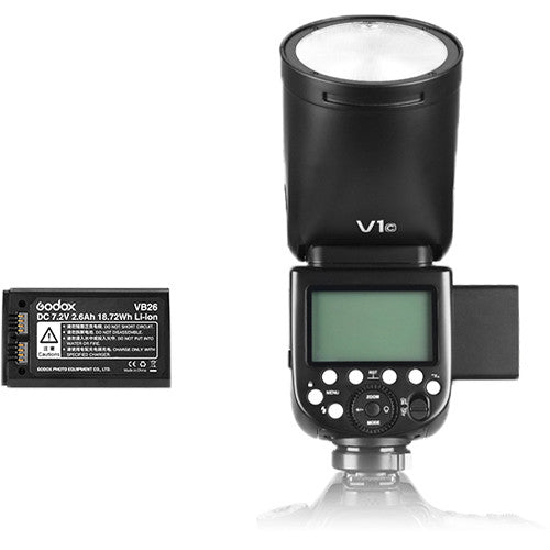 Godox V1-N round-head speedlight for Nikon with circular flash head, control panel, and removable lithium-ion battery.