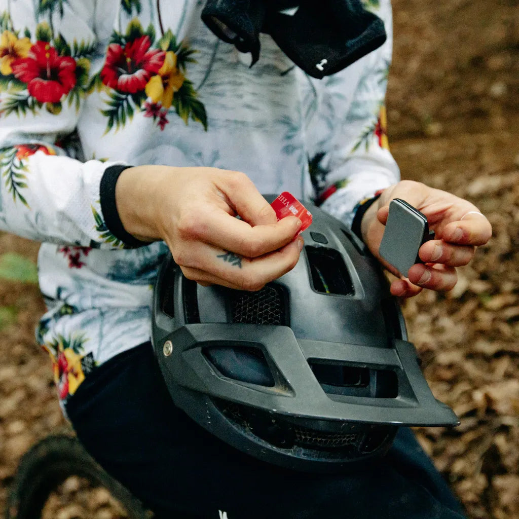 Example of how a curved adhesive mount fits onto a helmet.