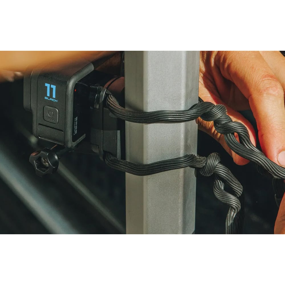 Close-up of a power adapter connected to a vehicle's cigarette lighter socket with a digital display showing voltage.