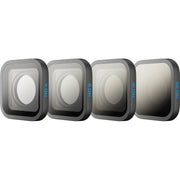 Four camera lens filters on a white background