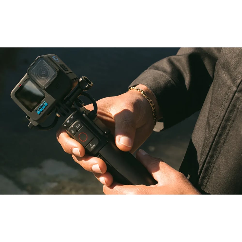 GoPro VOLTA Battery Grip + Tripod Remote in black, featuring integrated battery handle, fold-out tripod legs, built-in wireless remote, and USB-C charging port.