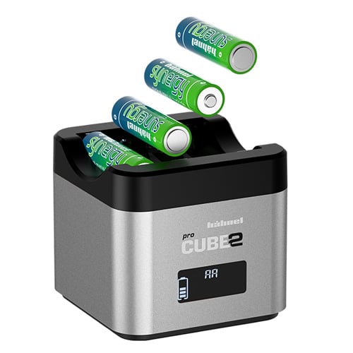 Batteries being charged in a Hubbell Pro Cube 2 battery charger on a white background