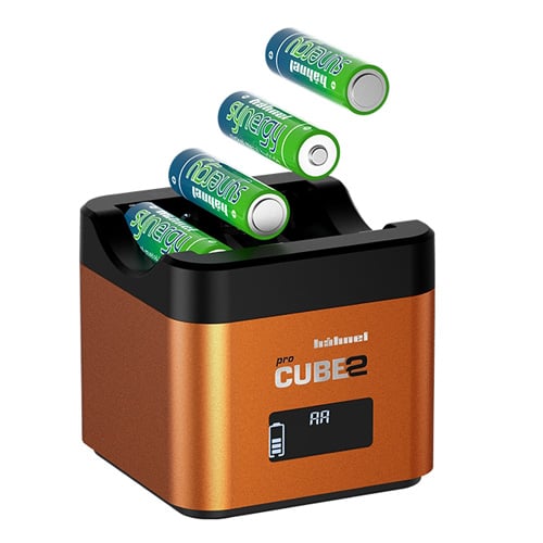 Battery charger with four green batteries on a white background
