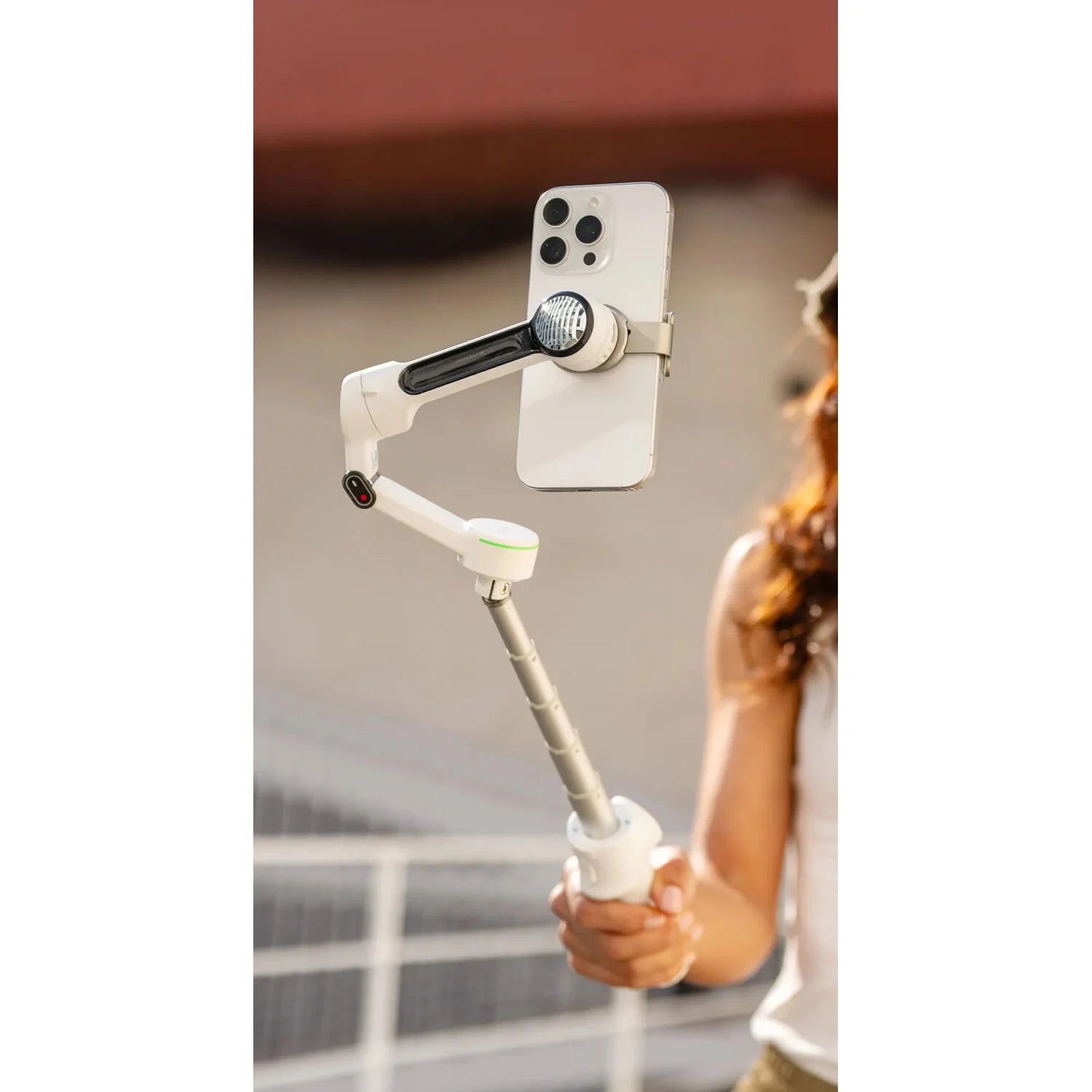 Insta360 Flow 2 Pro Gimbal Creator Kit in Gray with 3-axis stabilization, Deep Track 4.0 AI subject tracking, built-in 210mm selfie stick and tripod, magnetic phone clamp compatible with iPhone 12 or later, included Flow Spotlight, USB-C and Lightning charging cables, protective pouch, and up to 10 hours battery life.