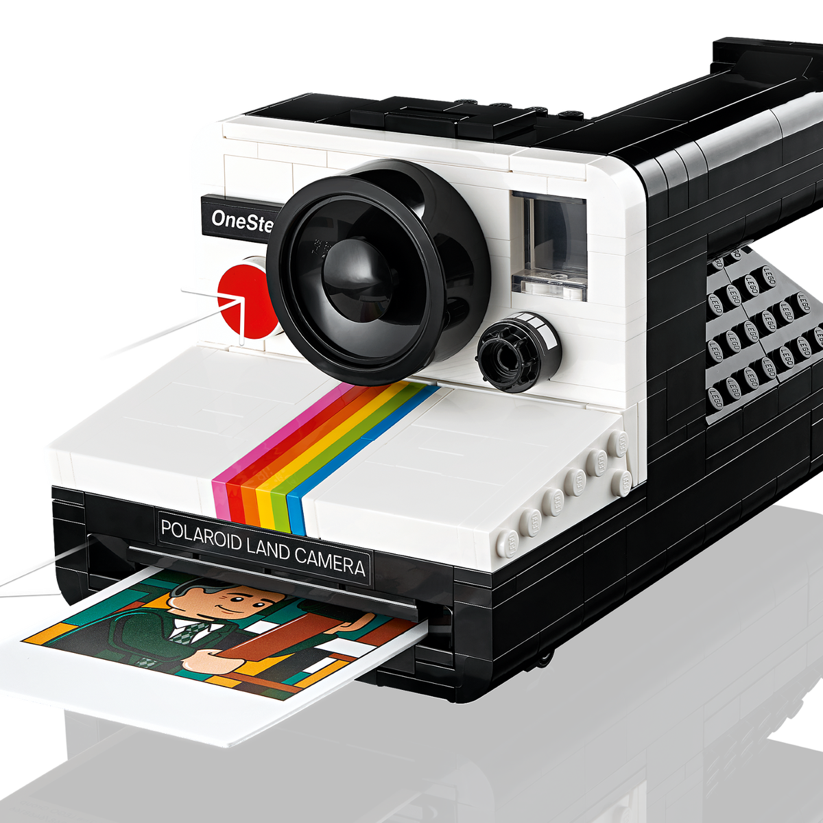 LEGO Ideas Polaroid OneStep SX-70 Camera set with 516 pieces, features a realistic build with working viewfinder, iconic Color Spectrum, turnable exposure dial, shutter button, and brick-built film pack that ejects photos