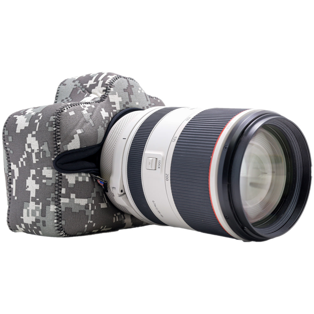 Camera with a lens and camouflage case on a white background