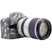 Camera with a lens and camouflage case on a white background