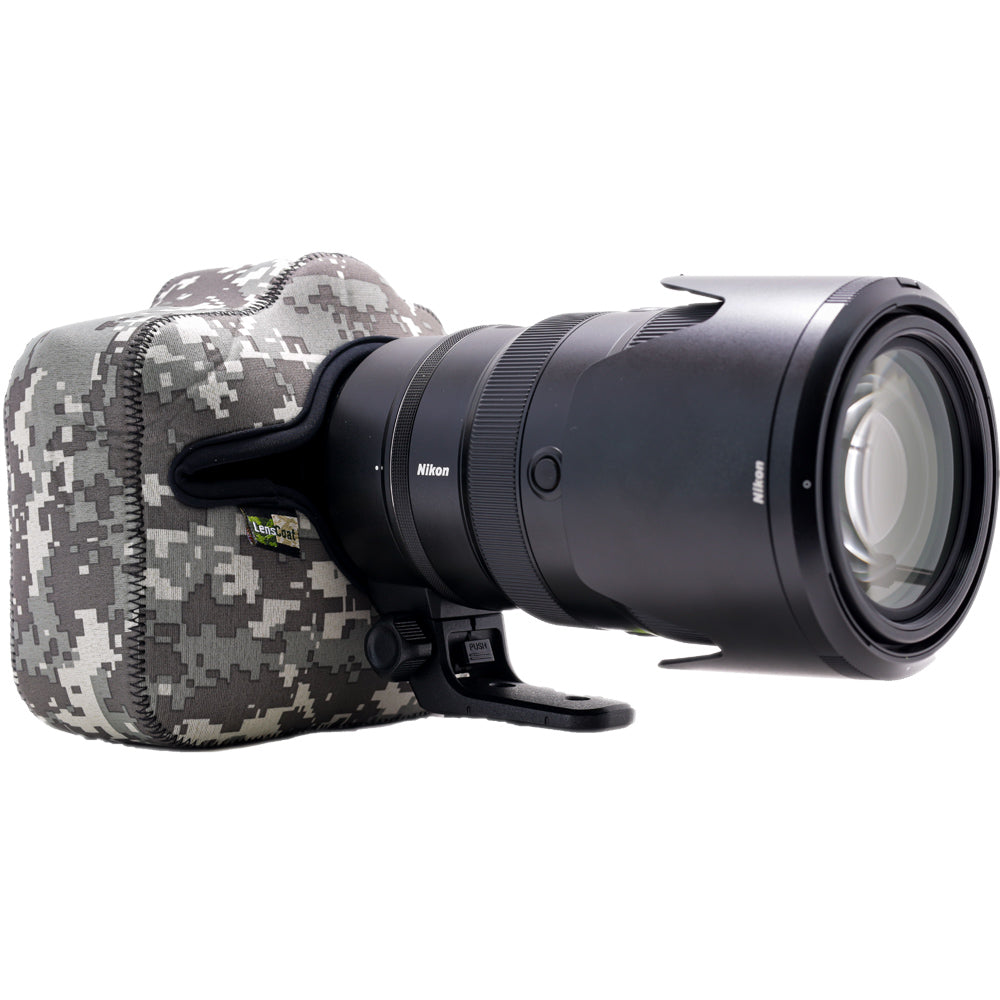 Camera with a large lens and camouflage case on a white background