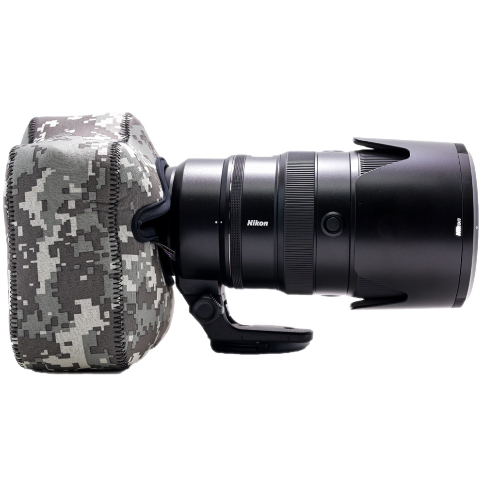 Nikon camera lens with camouflage lens hood on a white background
