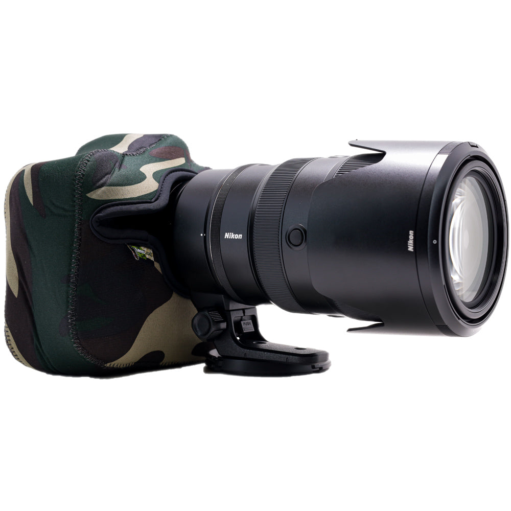 Camera lens with camouflage lens hood on a white background
