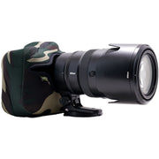 Camera lens with camouflage lens hood on a white background