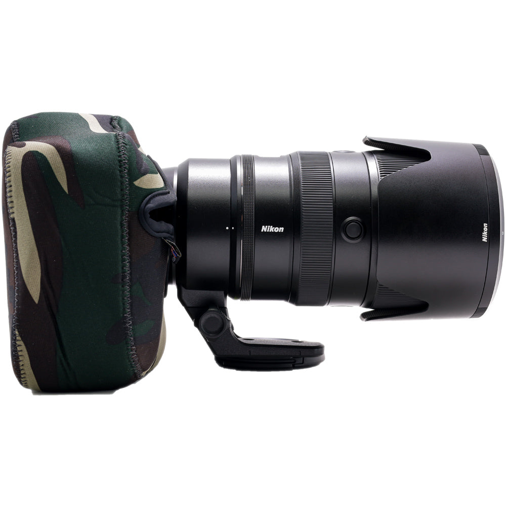 Nikon camera lens with camouflage case on a white background