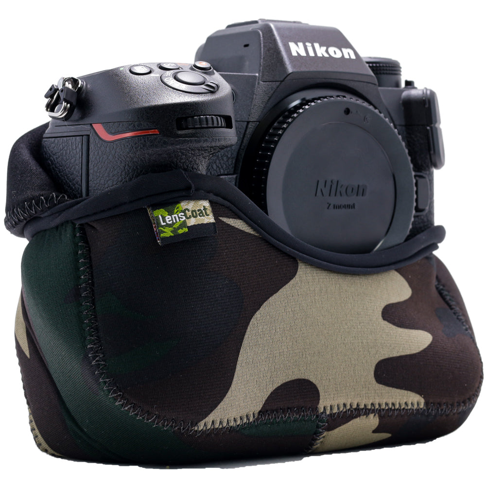 Nikon camera with a camouflage lens cover on a white background