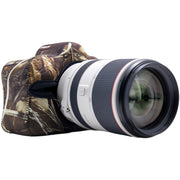 Camera lens with camouflage cover on a white background