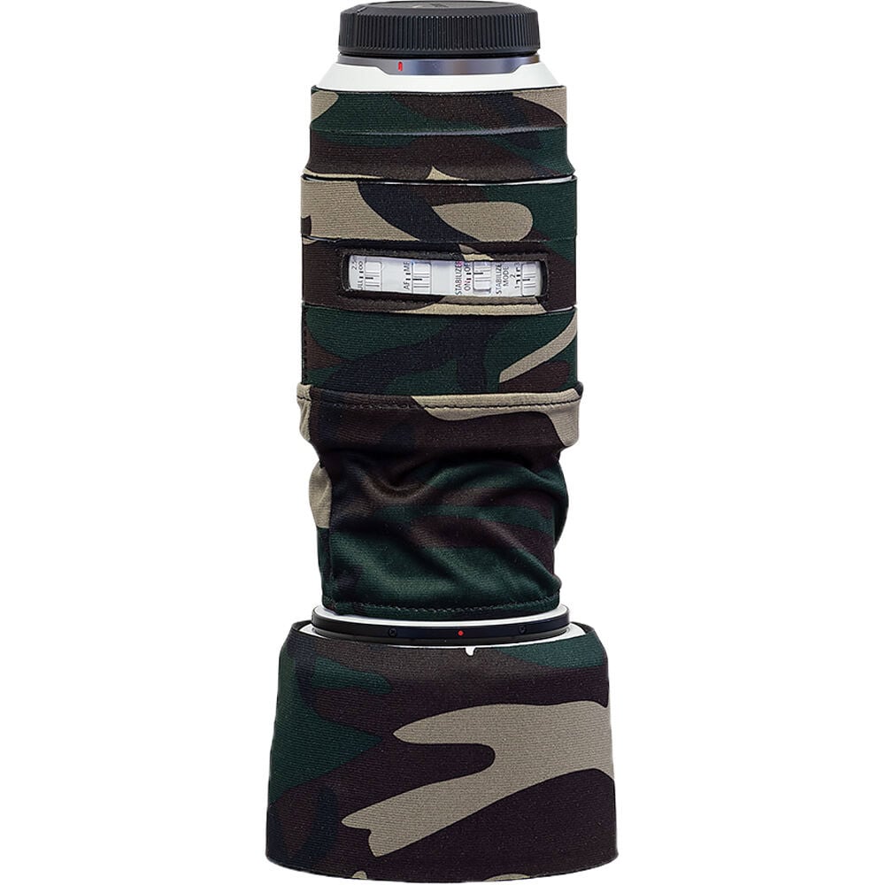 Camouflage lens hood on a camera lens with a white background