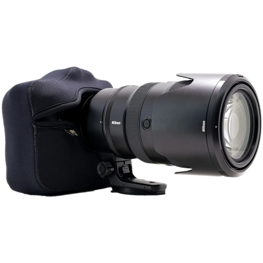 Camera lens with a black lens hood on a white background