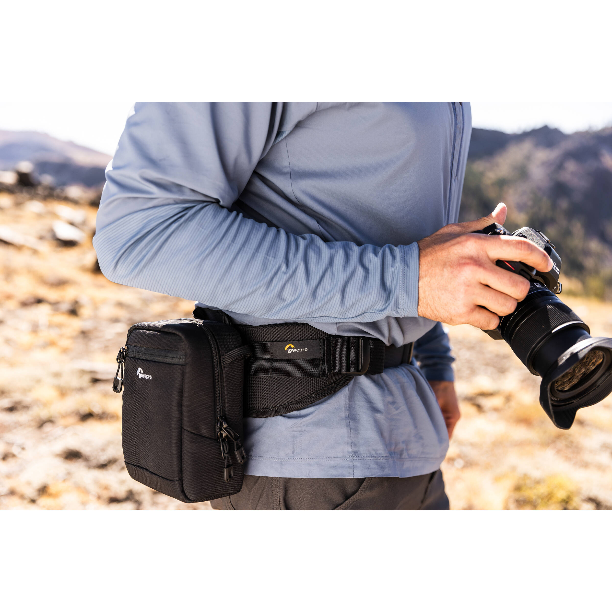 Lowepro ProTactic Utility Belt III in black, fits waists 76-148 cm, holds up to seven SlipLock pouches, includes deployable drawstring pocket for lens swaps or 1L water bottle, made with 92% recycled fabric for durability and comfort.