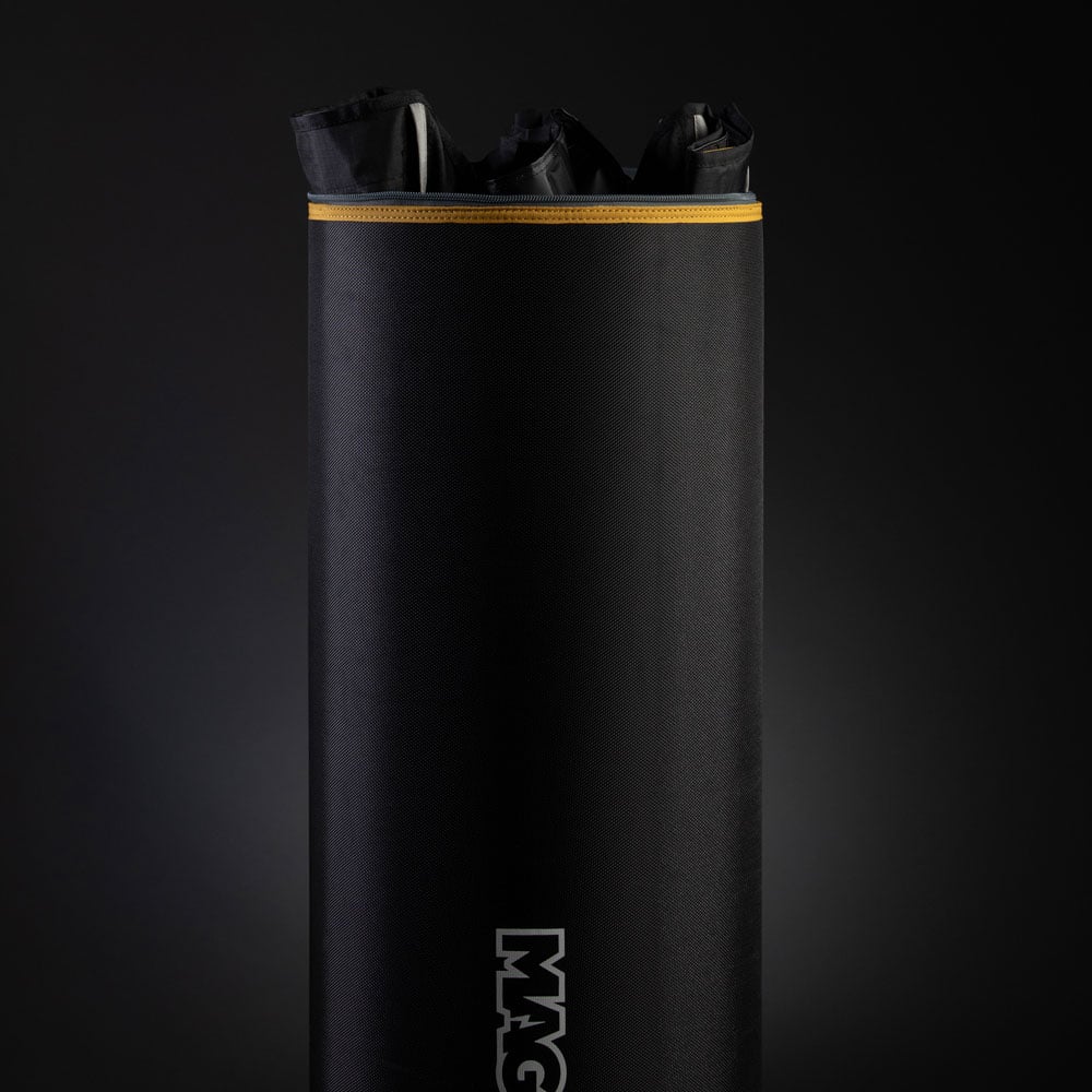 MagMod MagBox Large Case — tall cylindrical black travel case with padded sides, hard top and bottom to protect multiple MagBox softboxes and accessories.