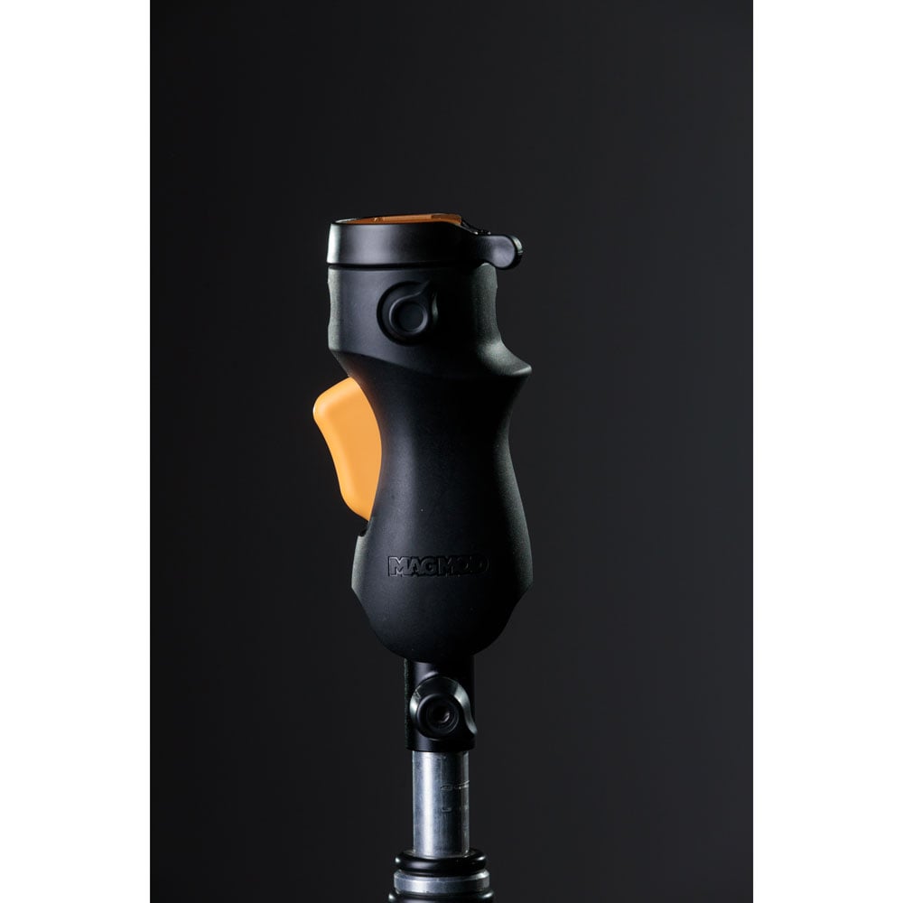 MagMod MagShoe 2 universal cold shoe bracket – ergonomic grip with orange release lever, locking mechanism for one-handed flash or modifier mounting.